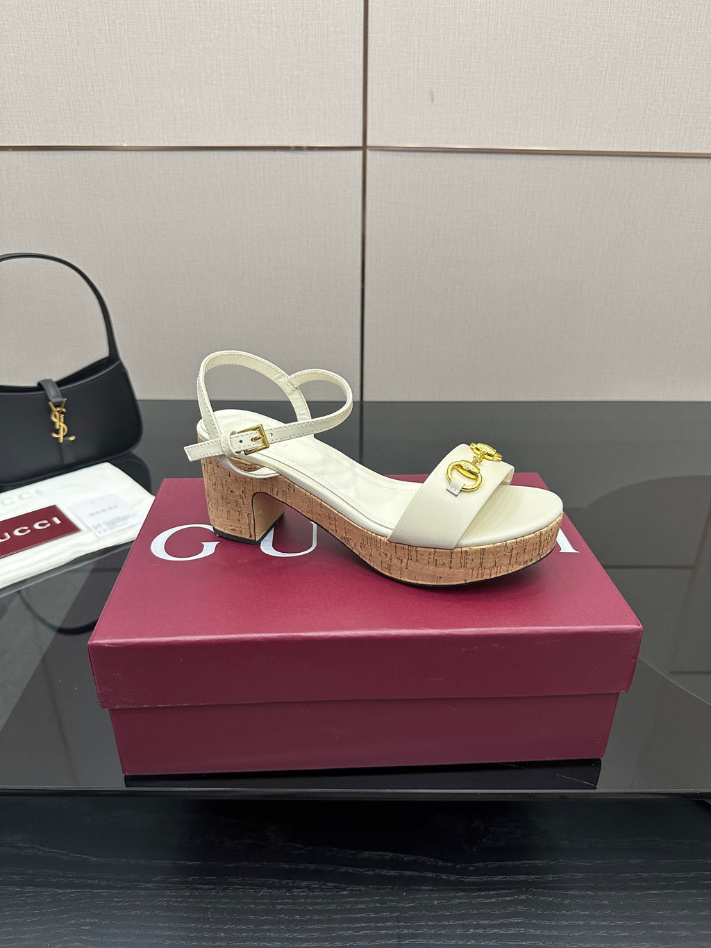 Gucci white heeled slingback sandals with gold horsebit detail and cork sole