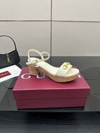 Gucci white heeled slingback sandals with gold horsebit detail and cork sole