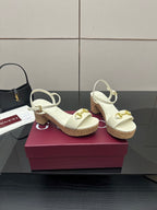 Gucci white heeled slingback sandals with gold horsebit hardware and cork sole