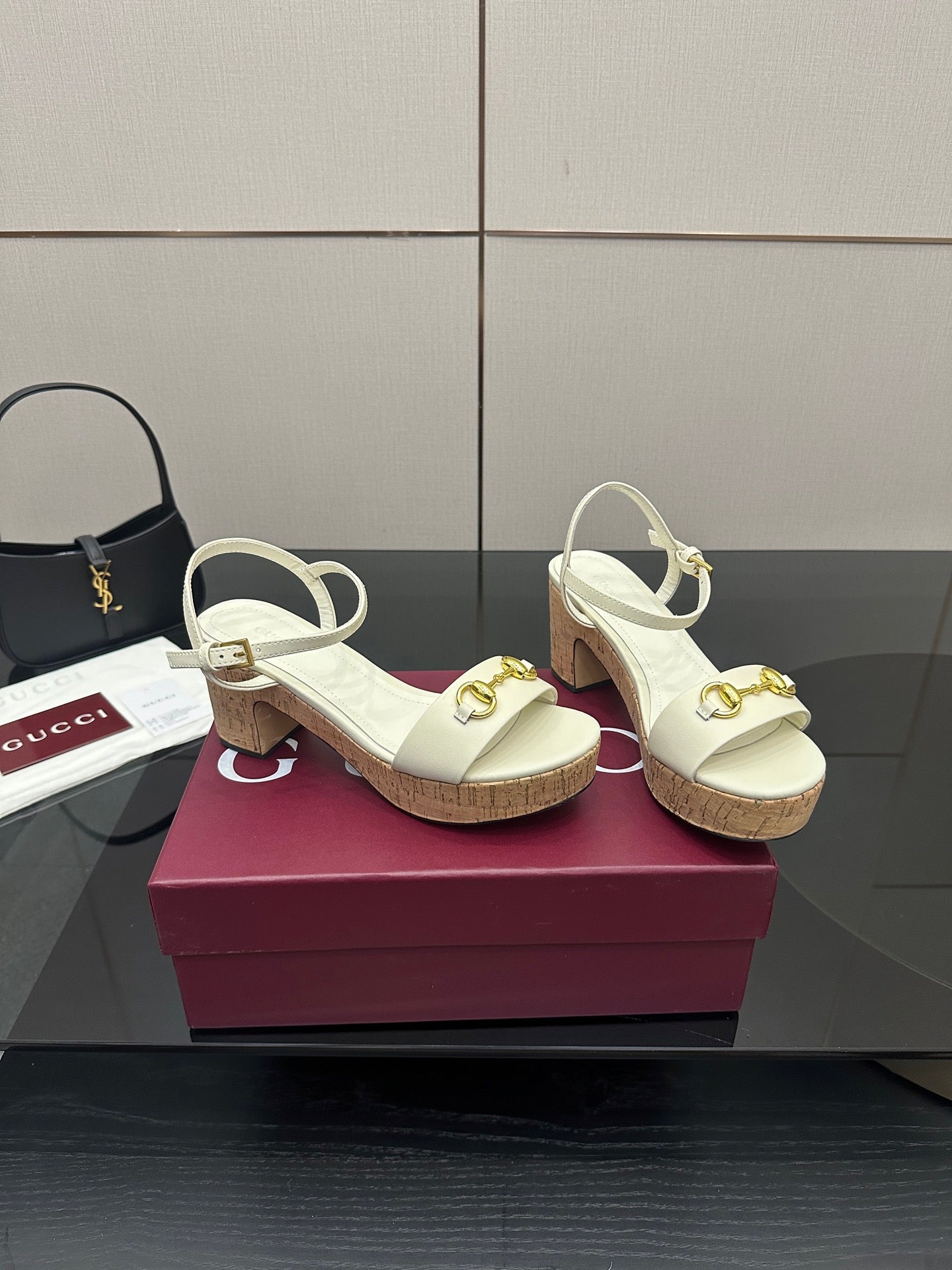 Gucci white heeled slingback sandals with gold horsebit hardware and cork sole