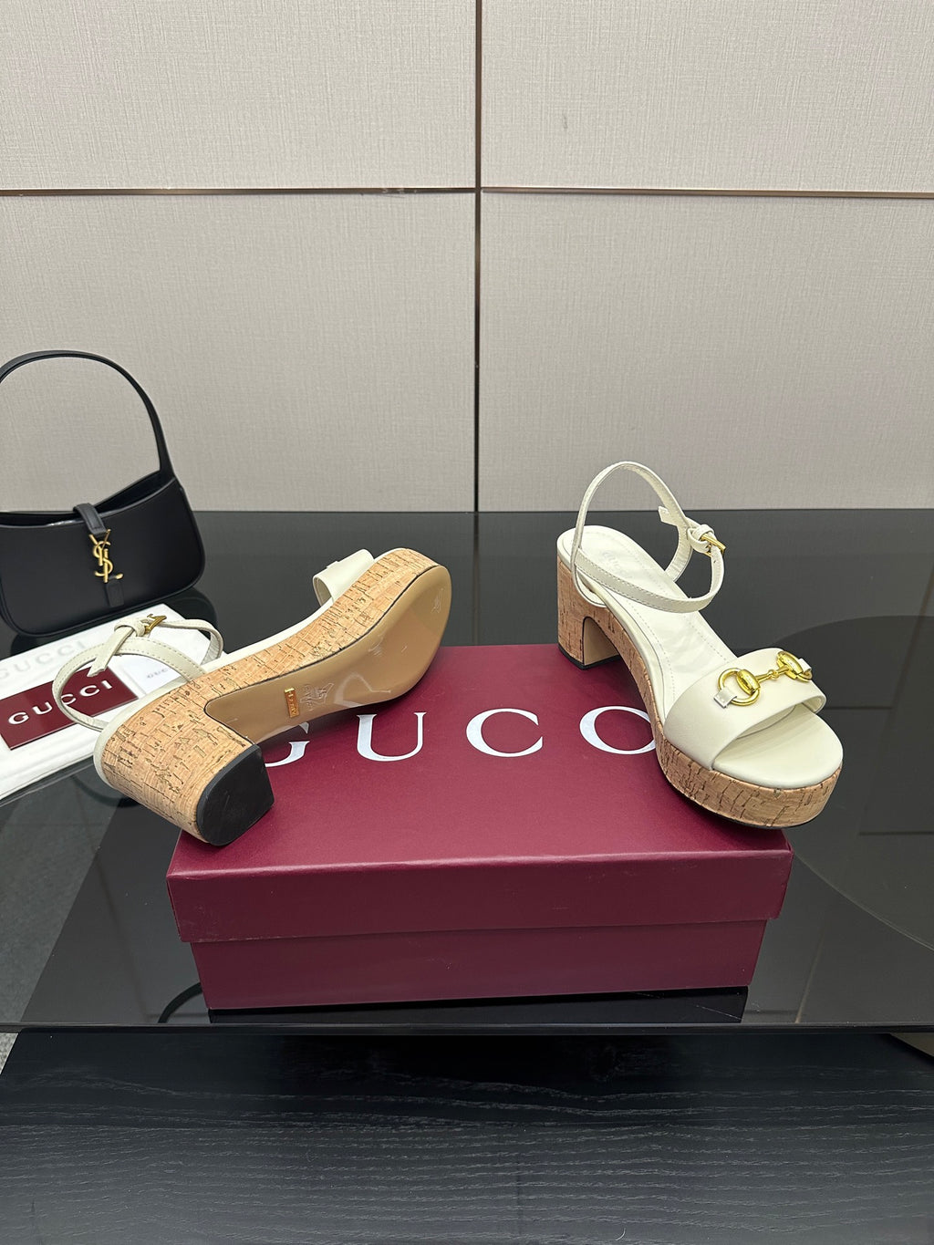 Gucci white heeled sandals with gold horsebit strap and textured cork footbed