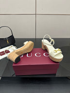 Gucci white heeled sandals with gold horsebit strap and textured cork footbed