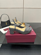 Gucci ladies platform heeled sandals in gray monogram canvas, angled side view