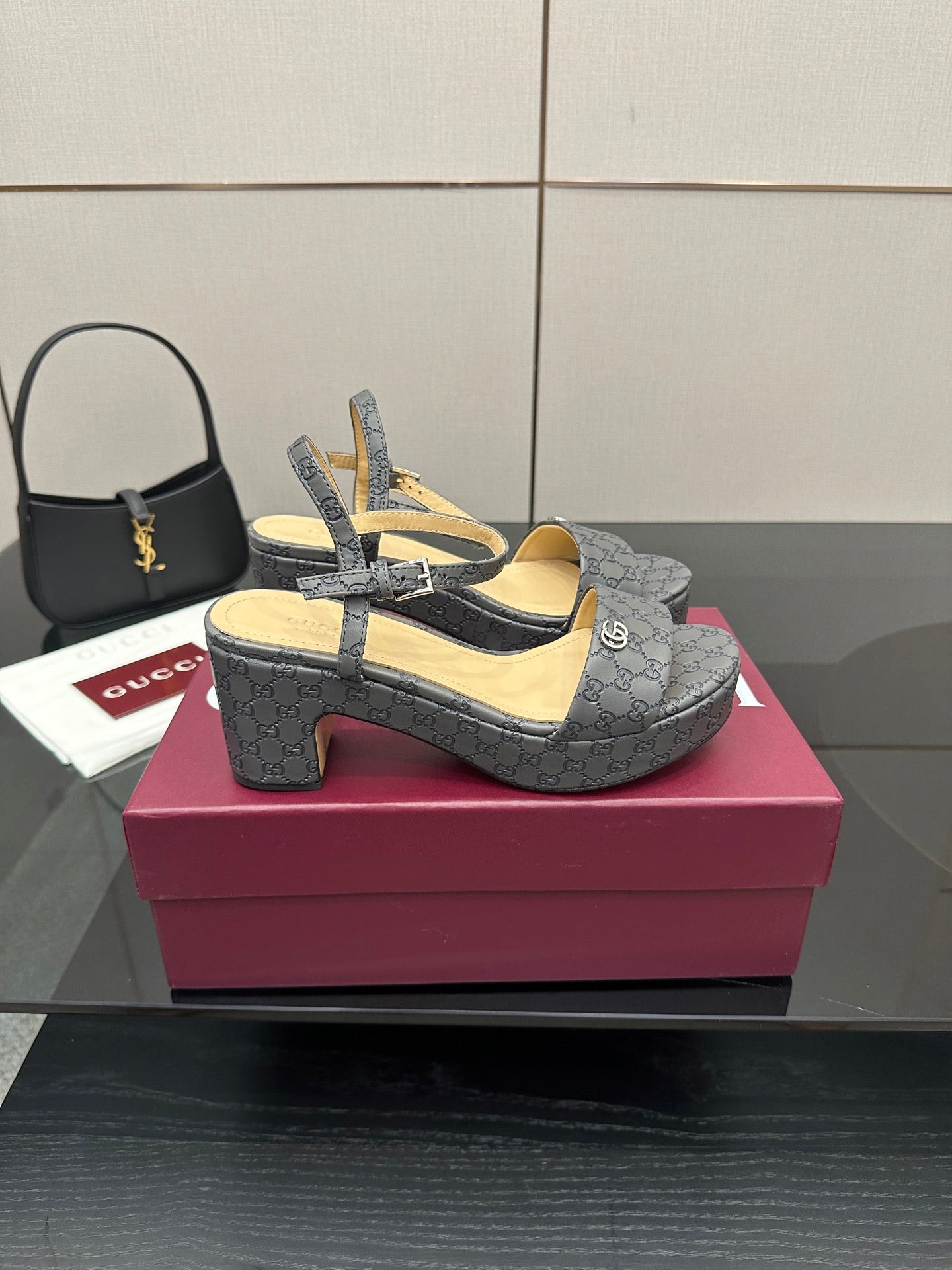 Gucci ladies platform heeled sandals in gray monogram canvas, angled side view