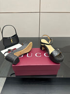 Gucci black platform sandals with ankle strap and GG monogram embossed design