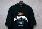 Black T-shirt front view with graphic print centered on chest