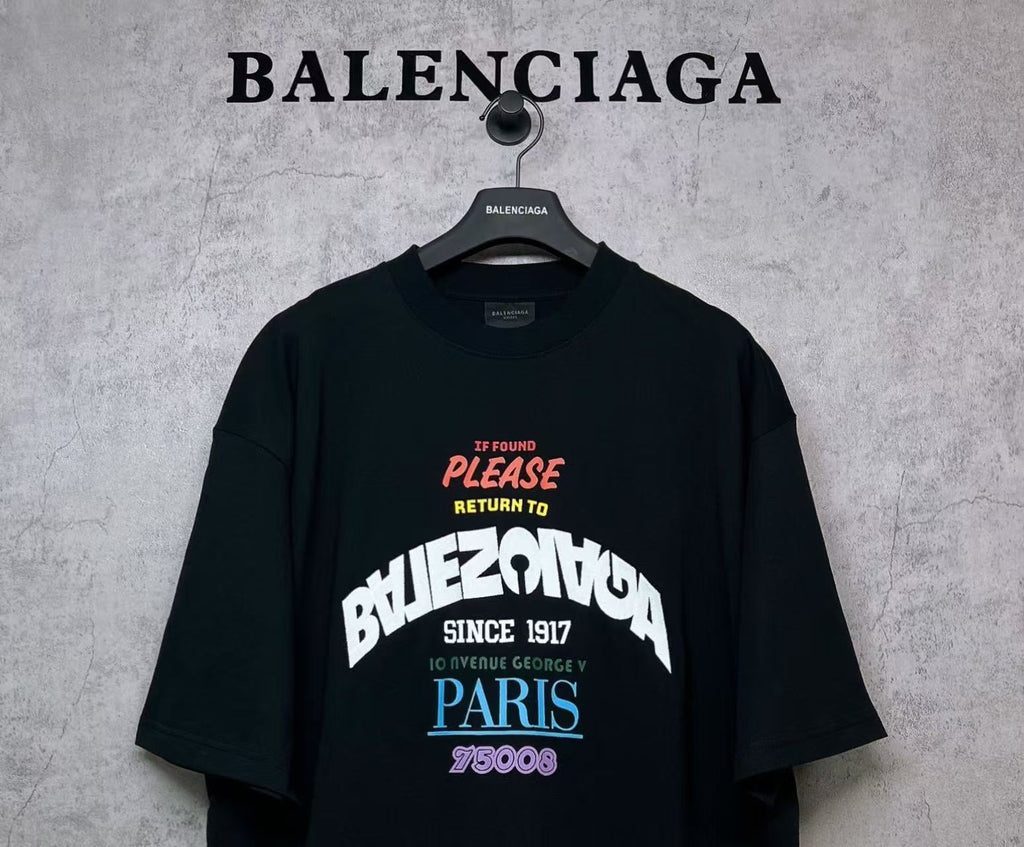 Black T-shirt with colorful front graphic print and “PARIS” text