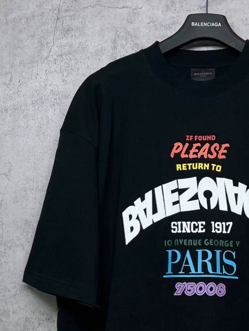 Black T-shirt close-up front graphic with “PLEASE RETURN TO PARIS”