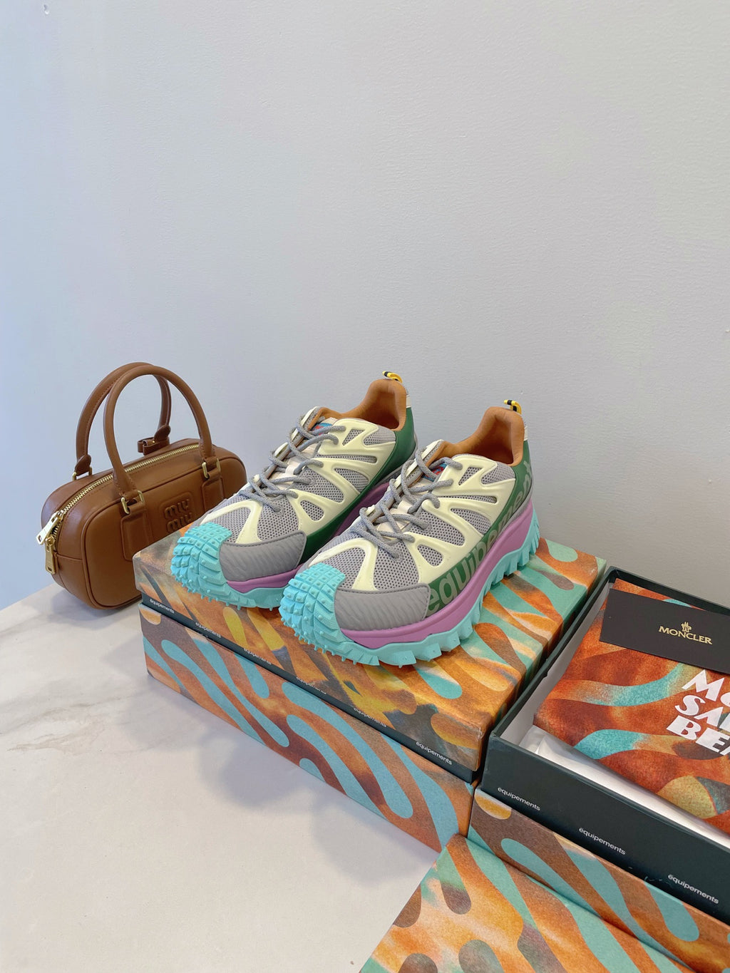 Moncler sneakers with white-gray mesh, green accents, multicolor lace-up, chunky sole