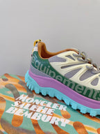 Moncler sneaker with white-gray upper, green collar, purple-to-blue sole detail