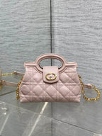 Dior quilted mini handbag in pale pink with gold chain and top handle