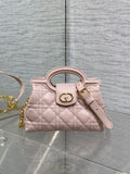 Dior quilted mini handbag in pale pink with gold-tone clasp and wrist strap
