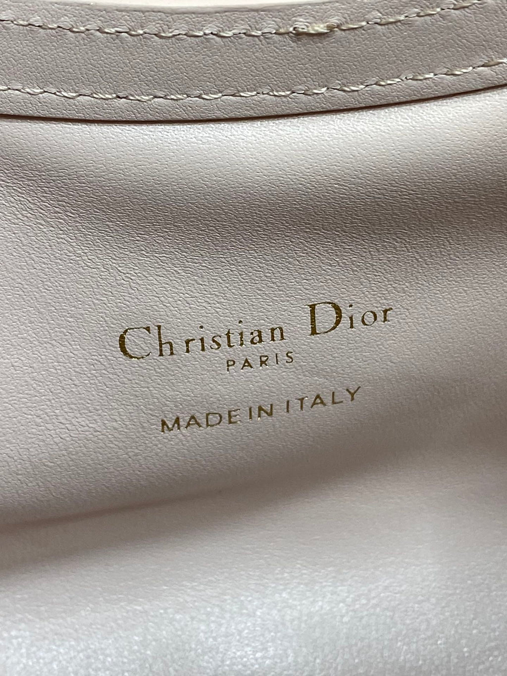 Dior Made in Italy text on pale pink leather lining