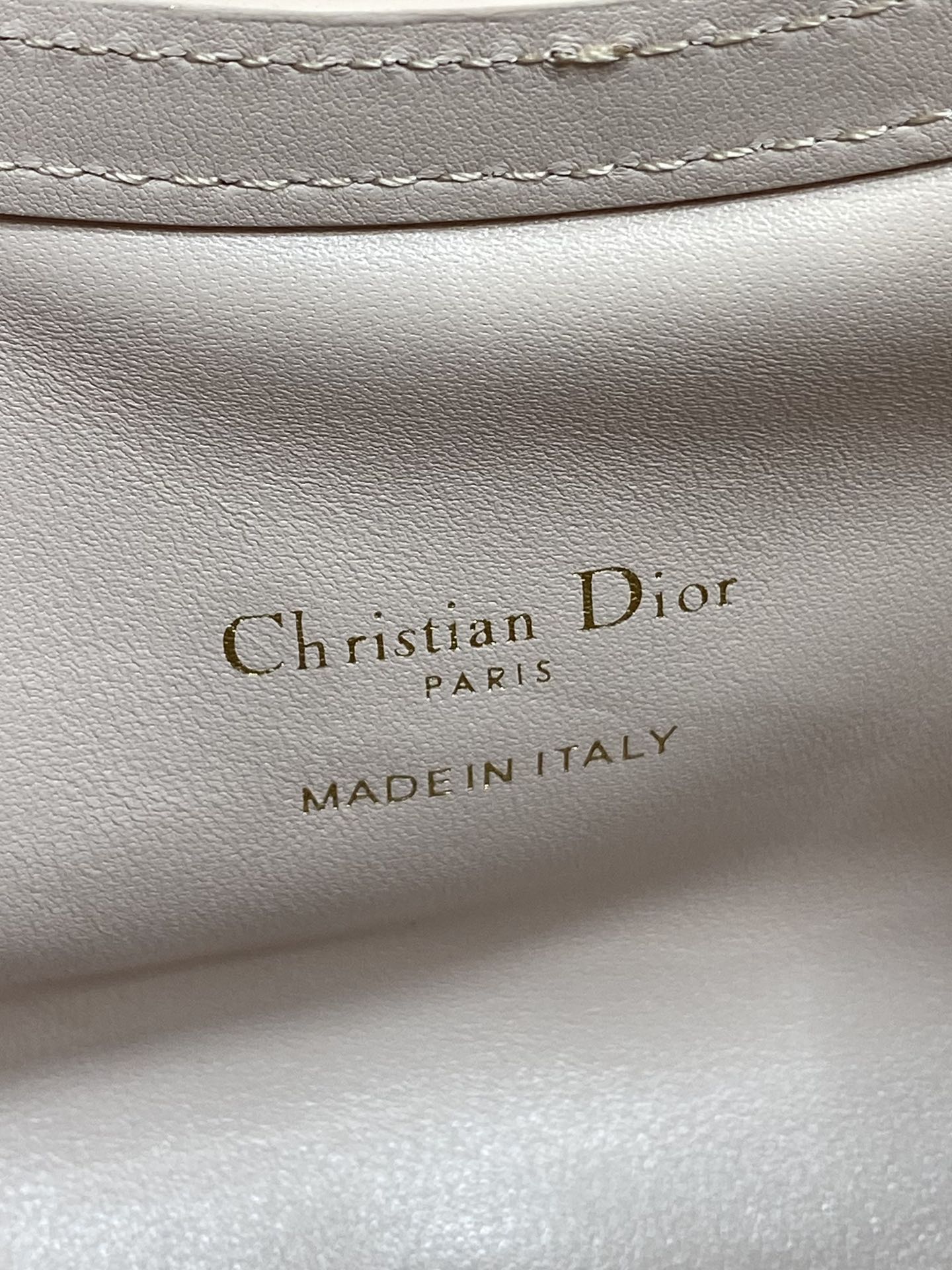 Dior Made in Italy text on pale pink leather lining