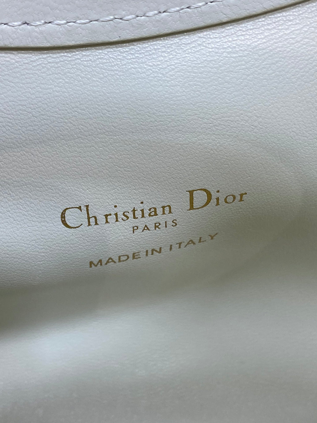 Dior logo on white leather lining: Christian Dior PARIS, MADE IN ITALY