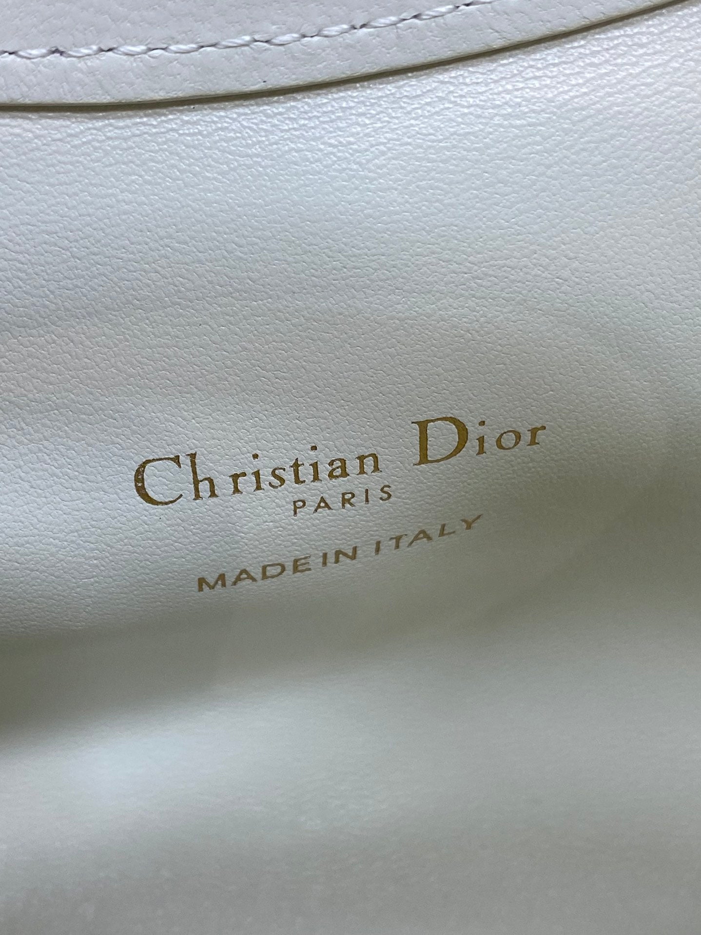 Dior logo on white leather lining: Christian Dior PARIS, MADE IN ITALY