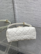 Dior quilted mini handbag with short handles and gold-tone hardware on front