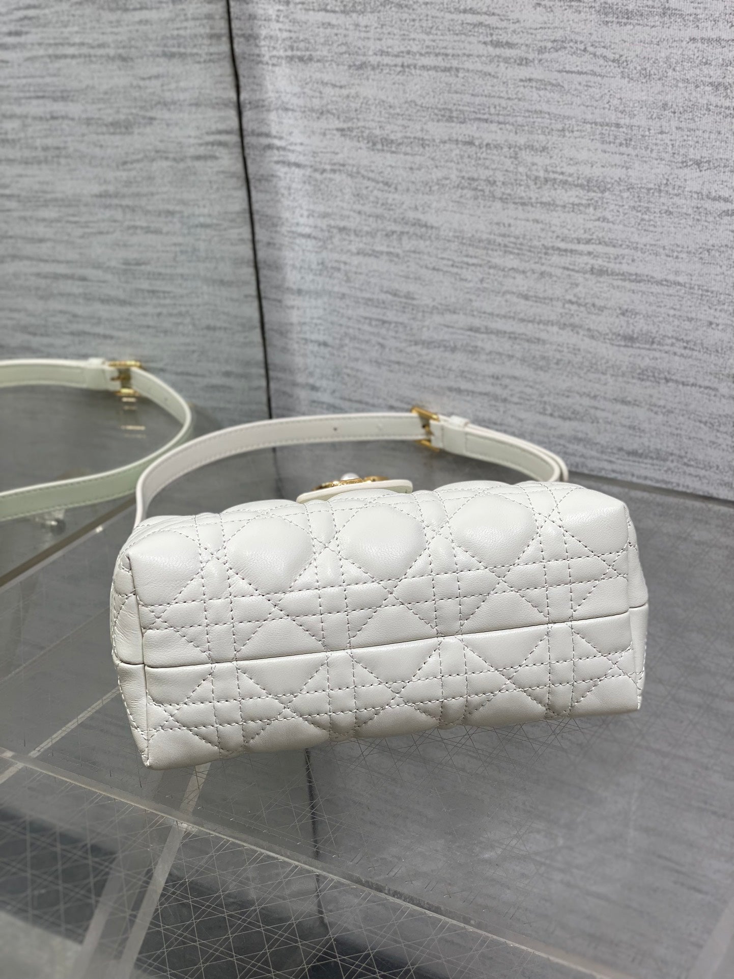 Dior quilted mini handbag with short handles and gold-tone hardware on front