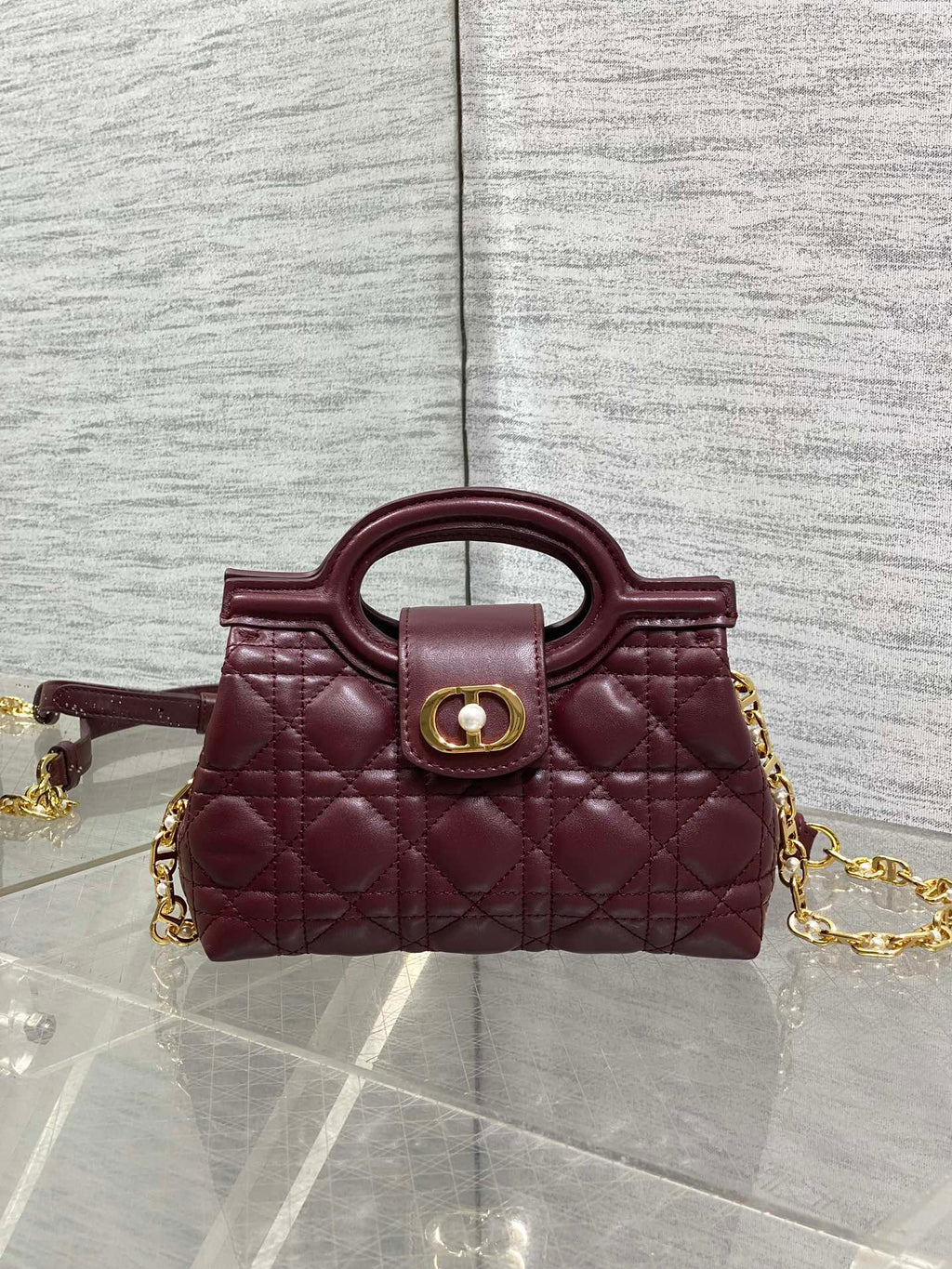 Dior quilted mini handbag, maroon with front logo clasp and gold chain strap