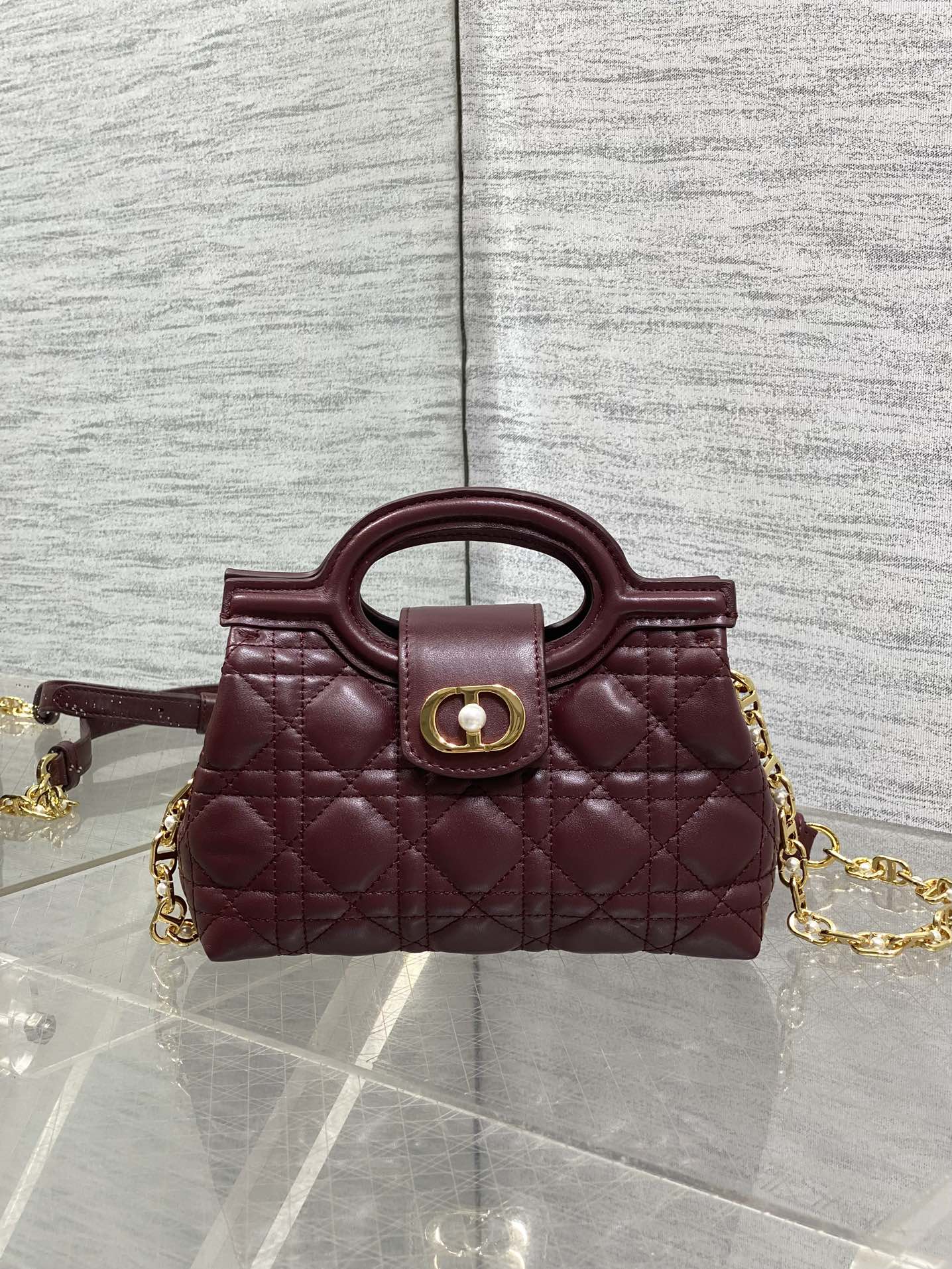 Dior quilted mini handbag, maroon with front logo clasp and gold chain strap