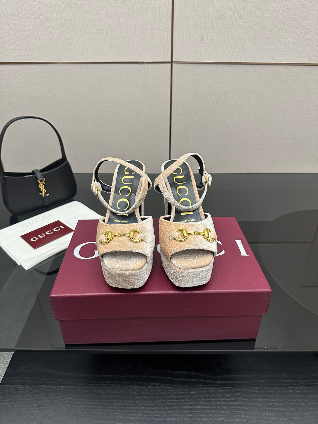 Beige and gold platform sandals with chunky heels, sling straps, and gold buckle accents