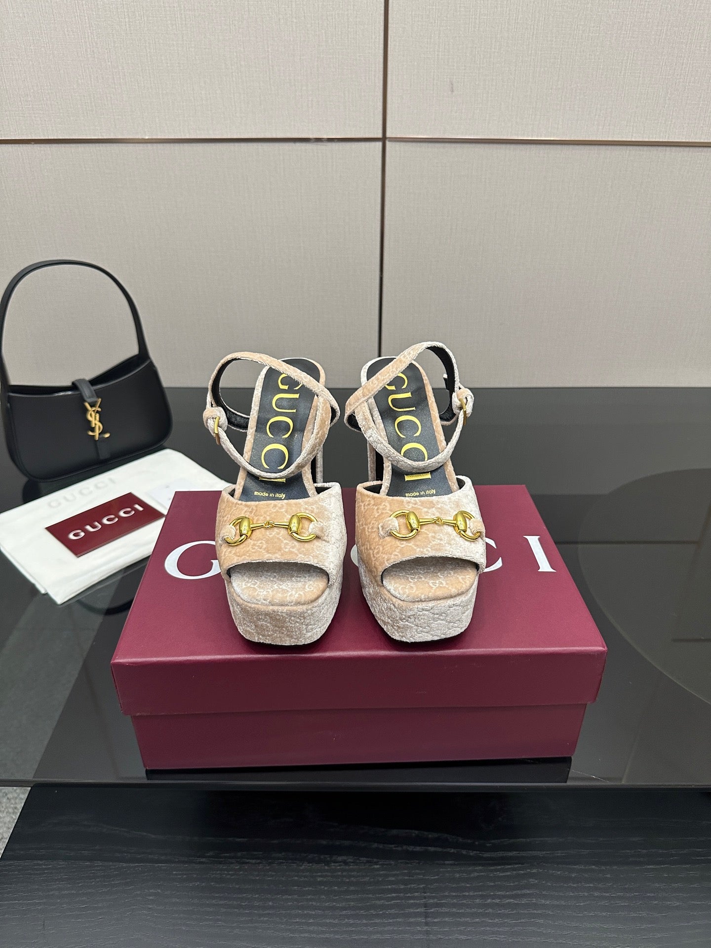 Beige and gold platform sandals with chunky heels, sling straps, and gold buckle accents