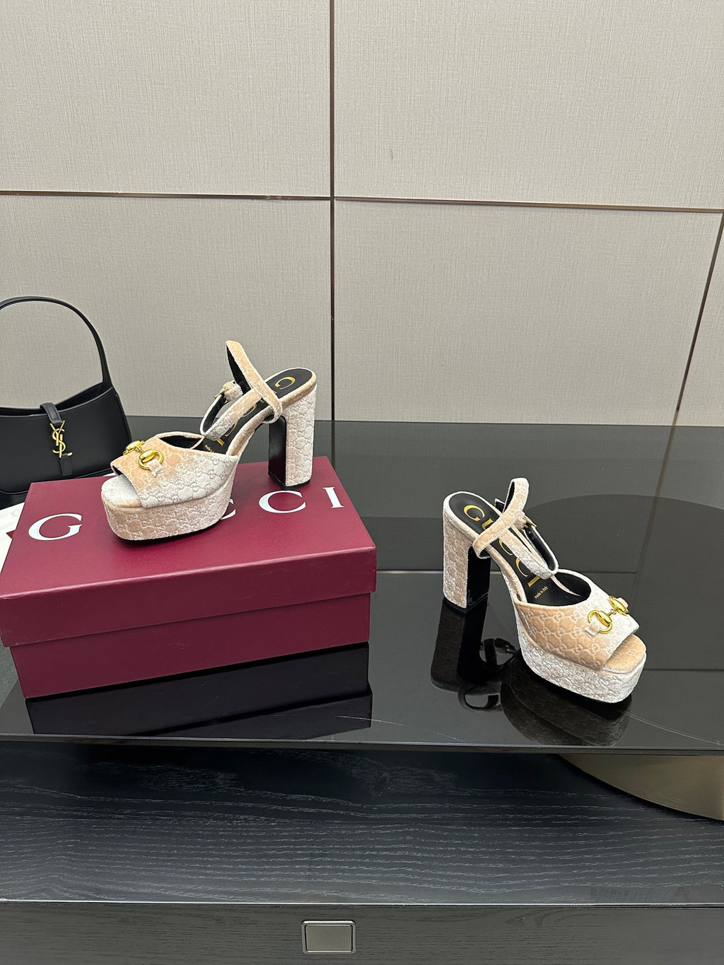Beige and gold platform sandals with chunky heel, sling straps, and gold buckle detailing