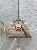 Beige quilted mini handbag with top handle and gold-tone clasp
