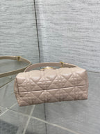 Beige quilted mini handbag with rounded zip top and gold hardware
