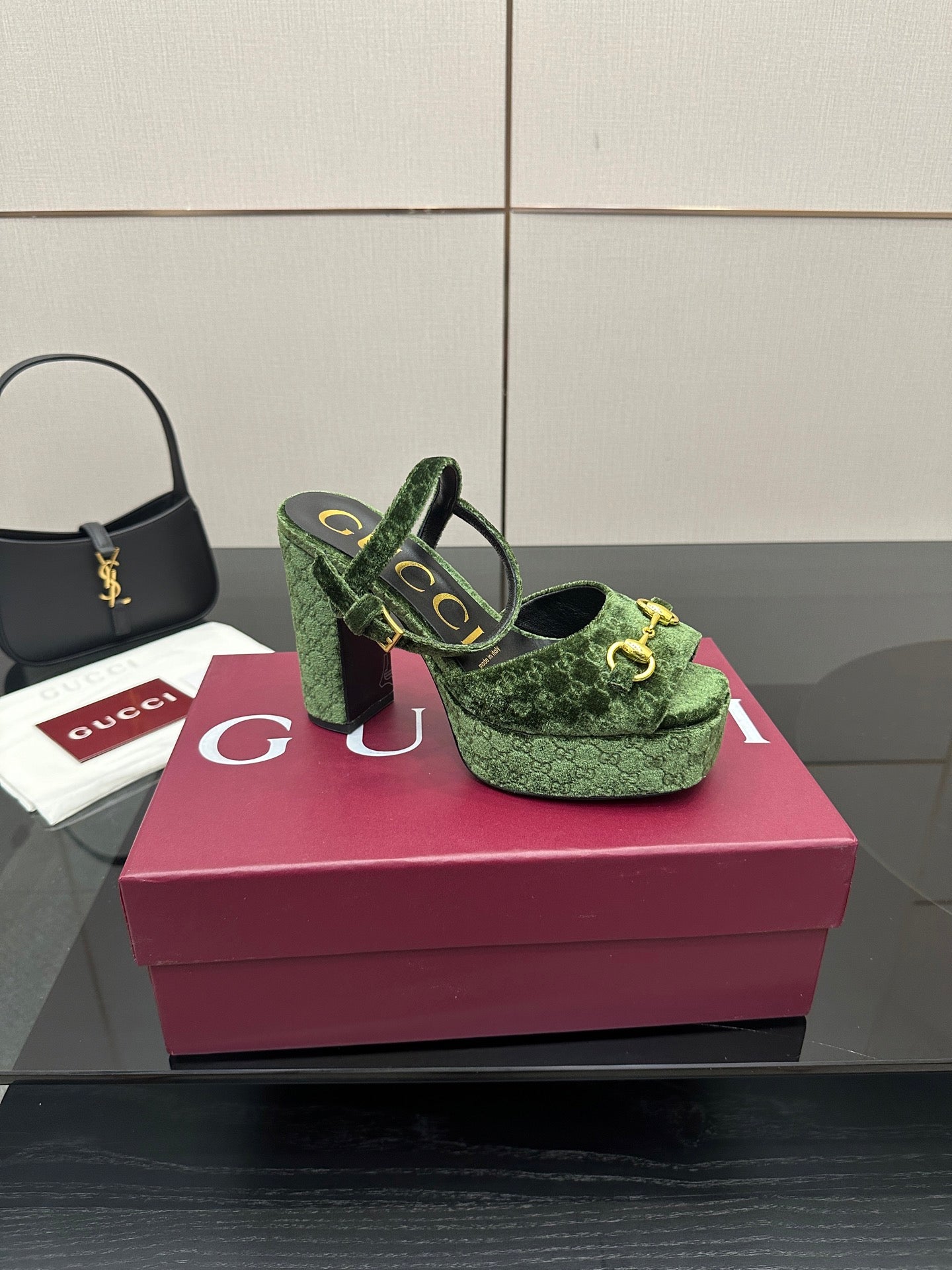 Gucci ladies green patterned platform heels, three-quarter view with gold-tone hardware