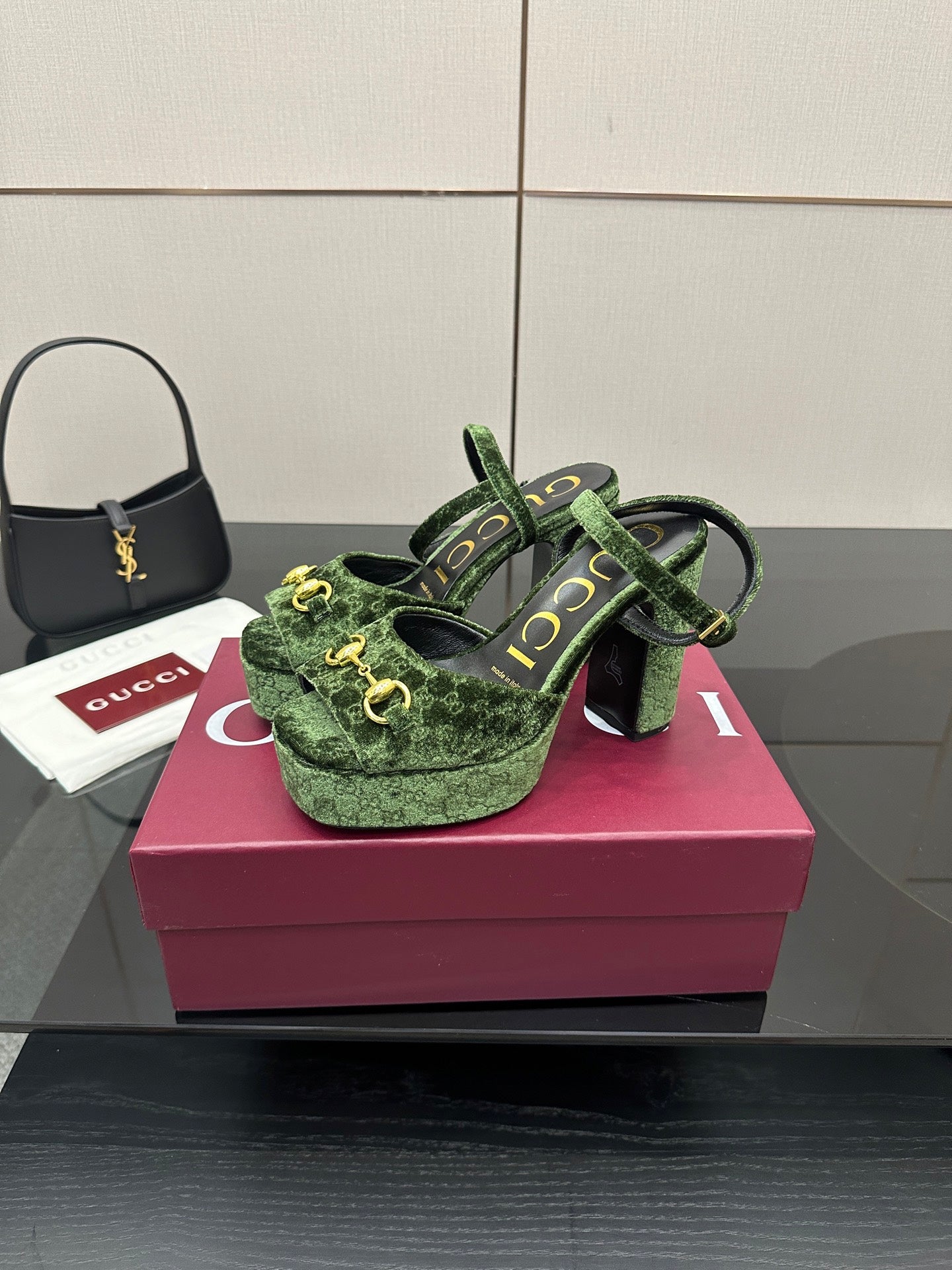 Gucci ladies green patterned platform heels, side view with gold-tone hardware