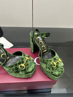 Gucci ladies green patterned platform heels, close-up of gold-tone hardware and straps
