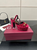 Red velvet platform heels with gold buckle accents and block heel, front-right view