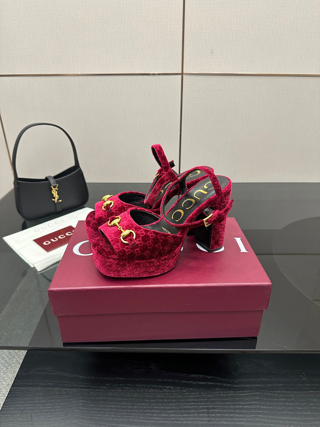 Red velvet platform heels with gold buckle detail and block heel, side view