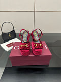 Red velvet platform heels with gold buckle detail, block heel, and ankle strap