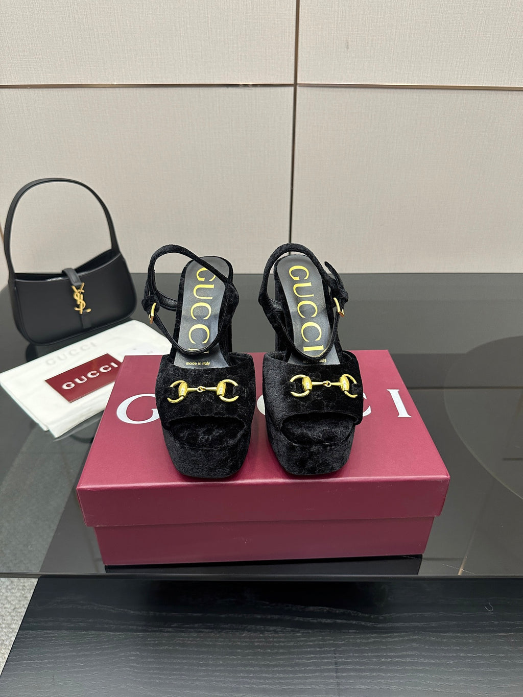 Gucci women's black heeled mules with gold buckle detail and cushioned platform