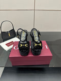 Gucci women's black heeled mules with gold buckle detail and cushioned platform
