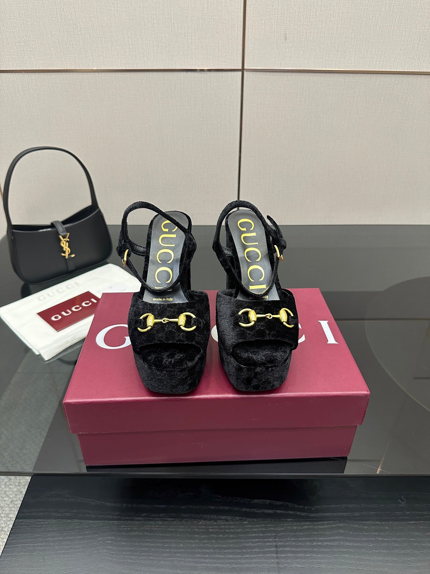 Gucci women's black heeled mules with gold buckle detail and cushioned platform