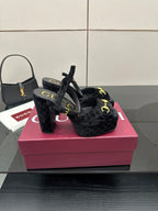 Gucci women’s black velvet heeled mules with gold buckle detail and tall block heel