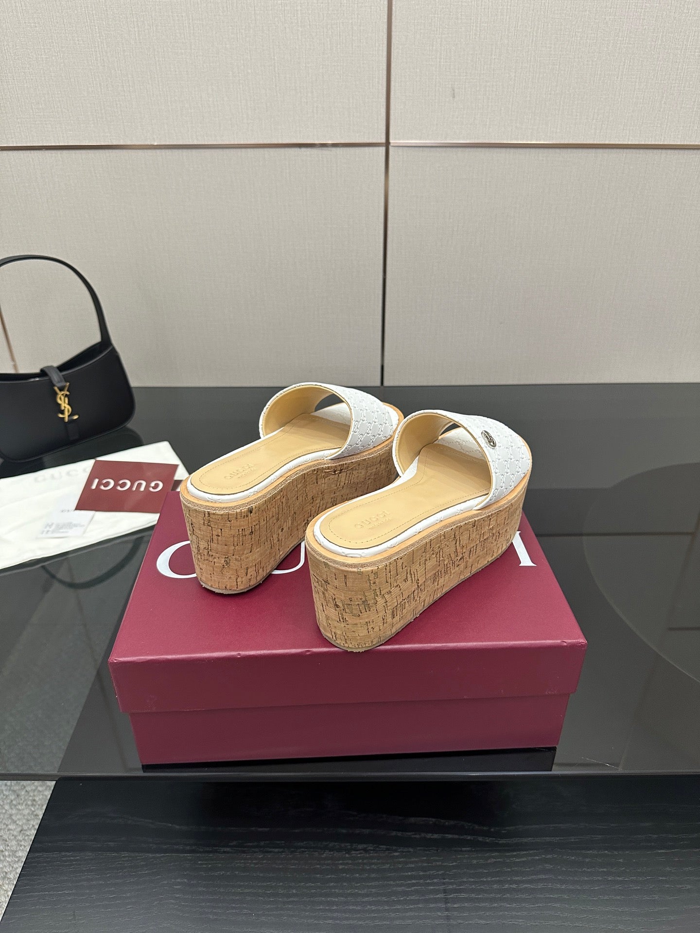 Gucci women's platform slide sandals, white upper, cork wedge; heel view