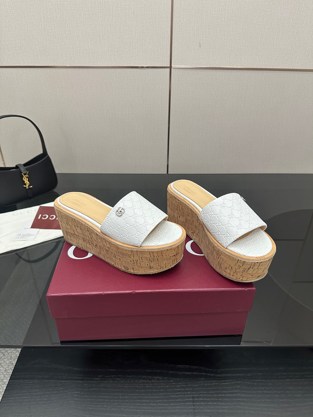 Gucci women's platform slide sandals, white upper with embossed pattern, cork wedge