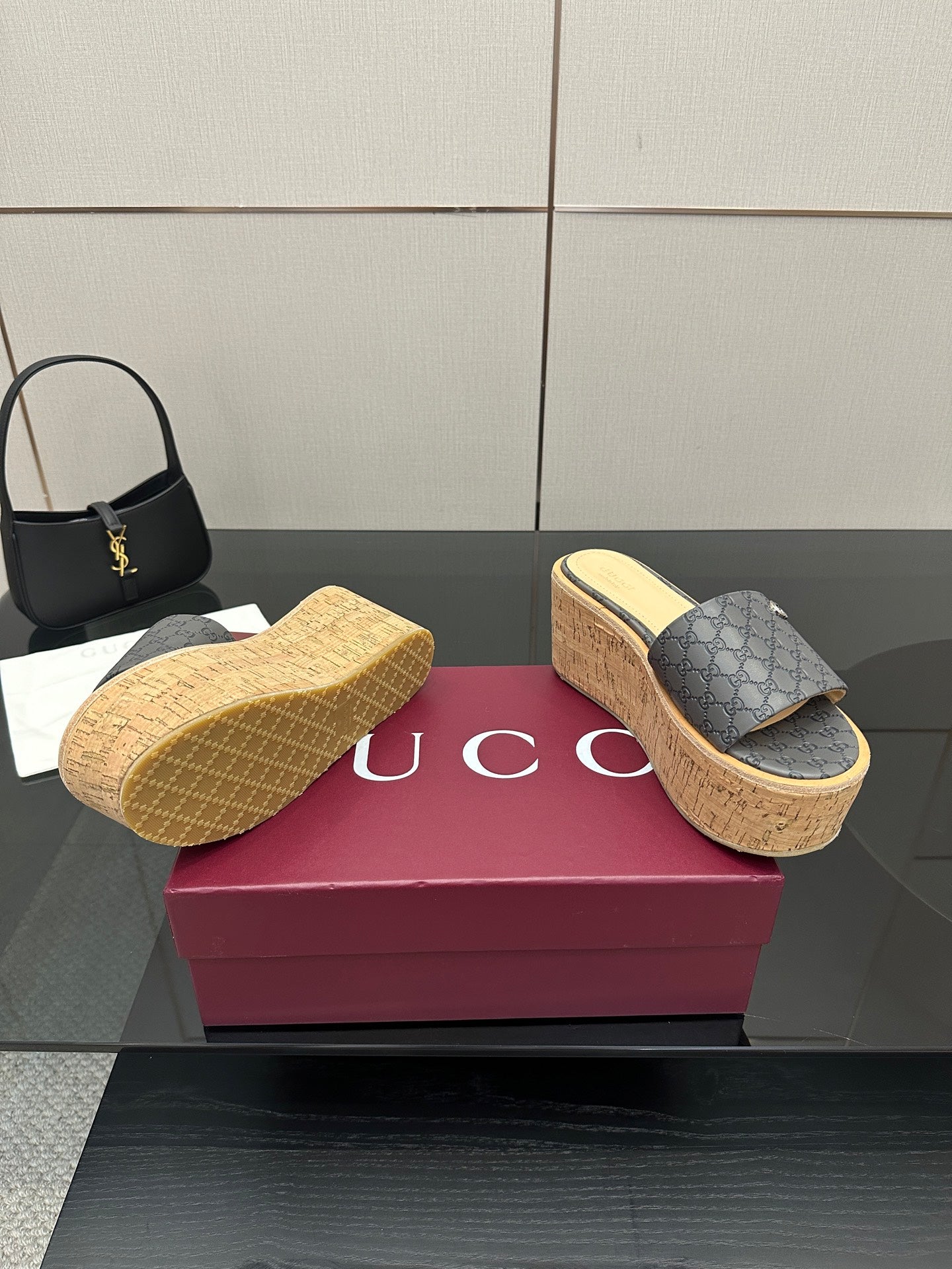 Gucci women’s platform slides in gray GG canvas, cork footbed and textured sole