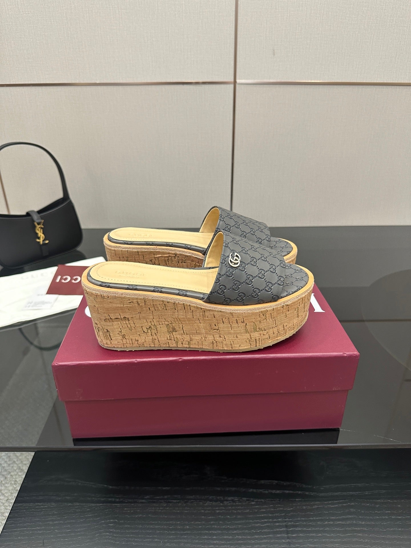 Gucci women’s slide sandals, gray GG canvas upper on cork platform wedge