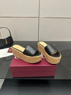 Gucci ladies black GG slip-on sandals with cork platform wedge and gold logo