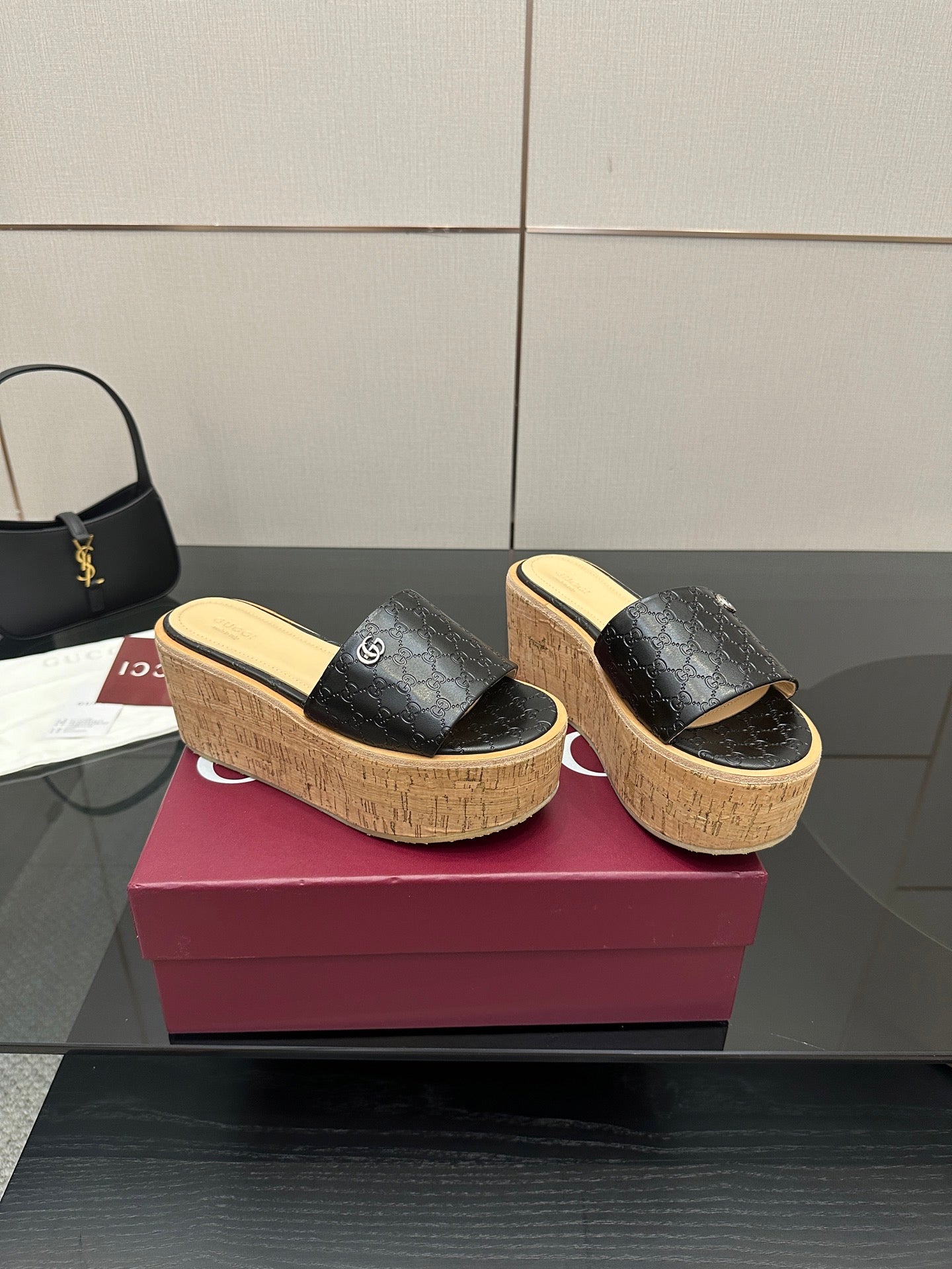 Gucci ladies black GG slip-on sandals with cork platform wedge and gold logo