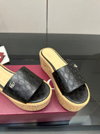 Gucci ladies black GG slide sandals with cork wedge platform and light interior