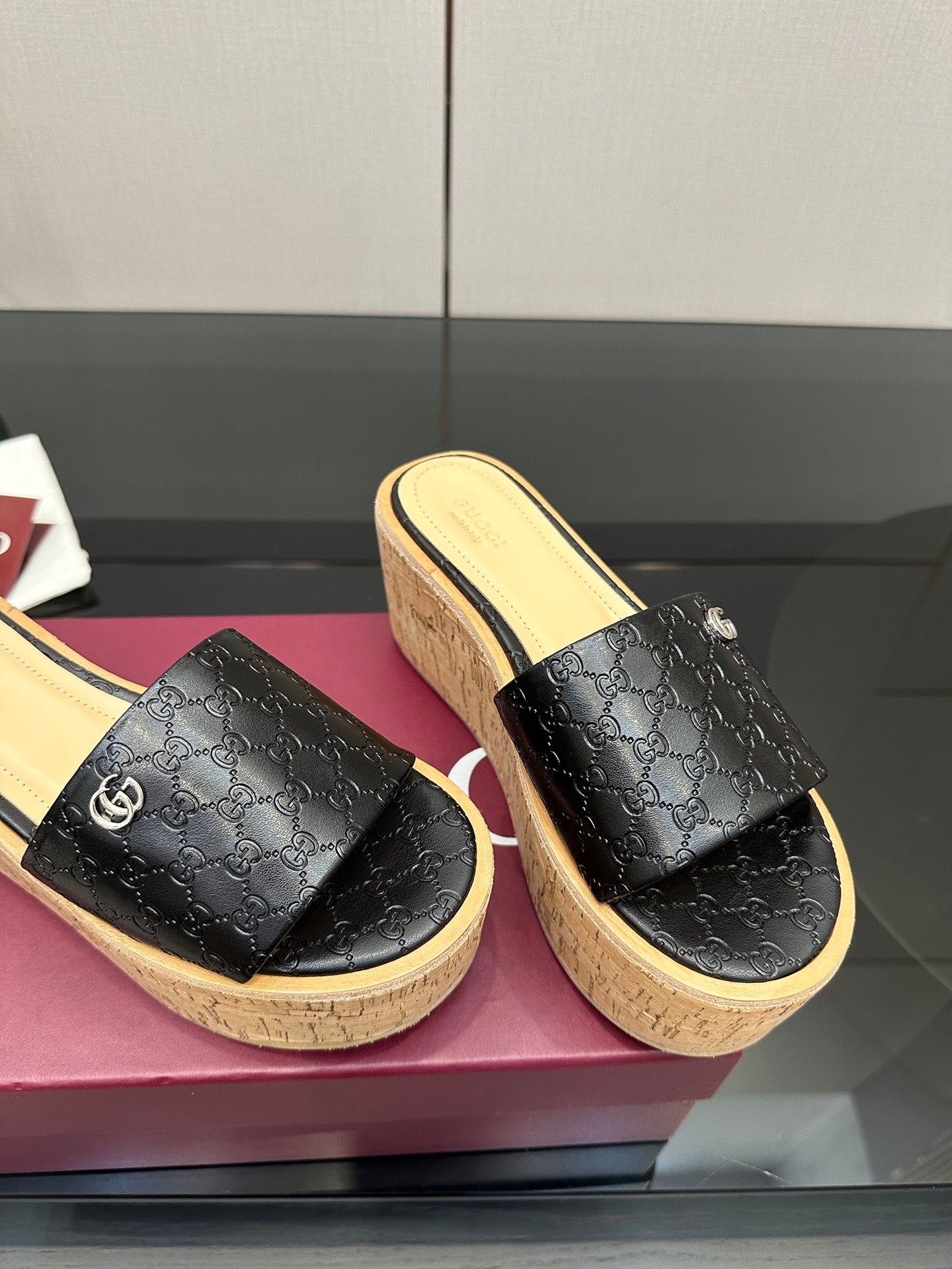 Gucci ladies black GG slide sandals with cork wedge platform and light interior