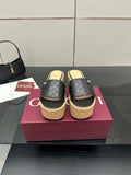 Gucci ladies black GG slide sandals with cork wedge platform and gold logo detail