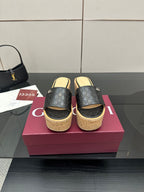 Gucci ladies black GG slide sandals with cork wedge platform and gold logo detail