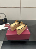 Gucci ladies black GG platform slide sandals with cork wedge and gold logo detail